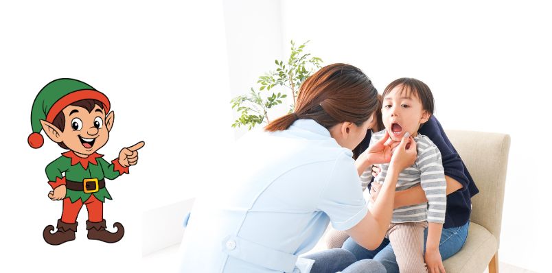 Child receiving dental check-up with cartoon elf character at Dentistry for Children Mount Kisco Pediatric Dental Center